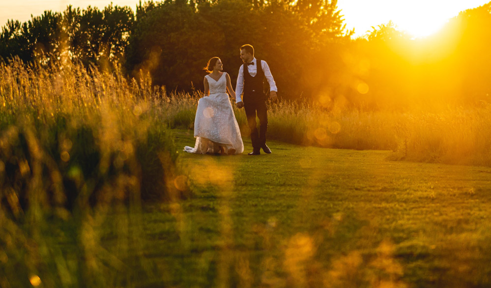 sunset walk at hales hall wedding